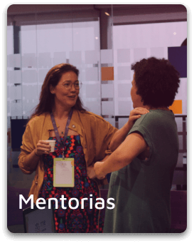 Imagem de duas mulheres conversando com o título "mentorias"